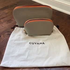 Cuyana leather travel case set with dust bag